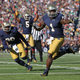 Greg Bryant runs for a touchdown in front of C.J. Prosise #20 as Evertt Golson #5 signals the score against the North Carolina Tar Heels at Notre Dame Stadium on October 11, 2014 in South Bend, Indiana. Via Getty.